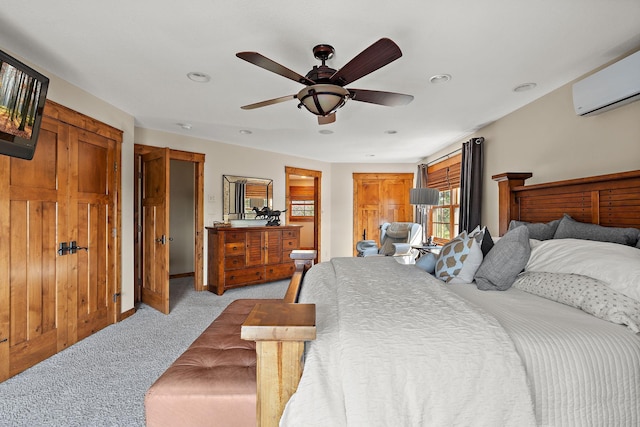 carpeted bedroom with an AC wall unit and ceiling fan