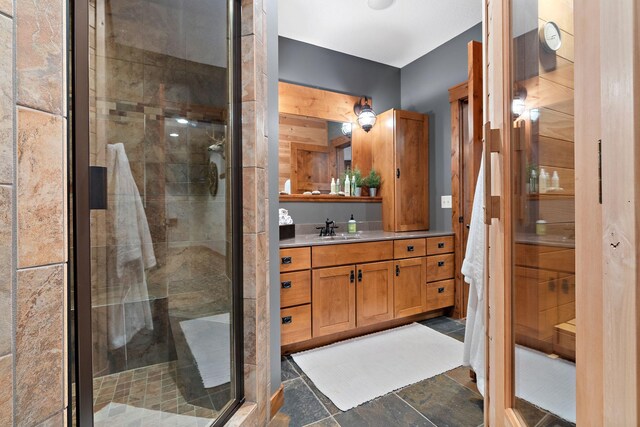 bathroom with walk in shower and vanity