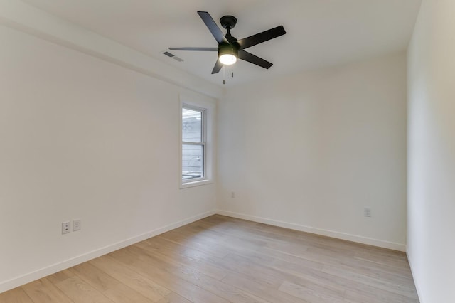 unfurnished room featuring ceiling fan and light wood-type flooring