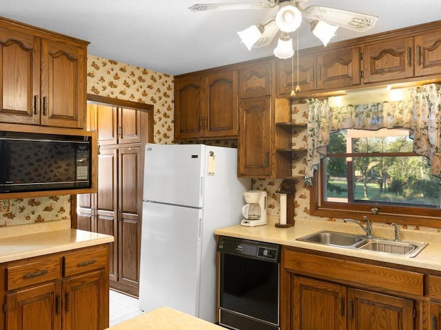 kitchen with ceiling fan, sink, and black appliances