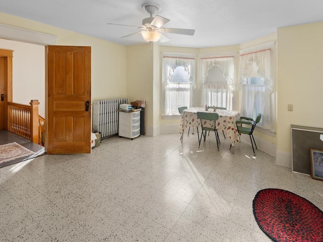 dining room featuring ceiling fan and radiator heating unit