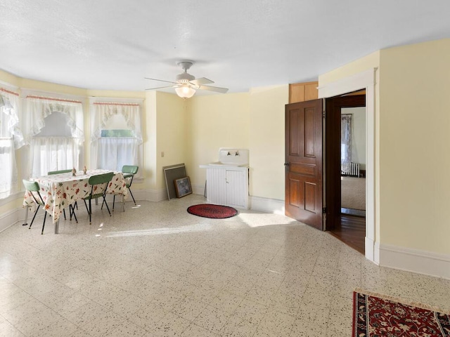 dining room featuring ceiling fan