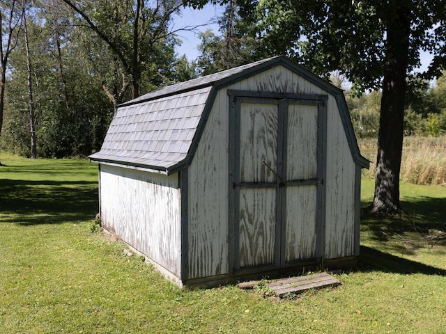 view of outdoor structure with a lawn