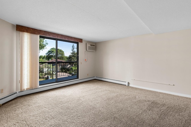 spare room with carpet flooring, a wall unit AC, a baseboard radiator, and a textured ceiling