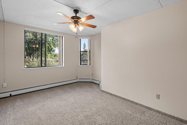 carpeted spare room featuring a textured ceiling and ceiling fan