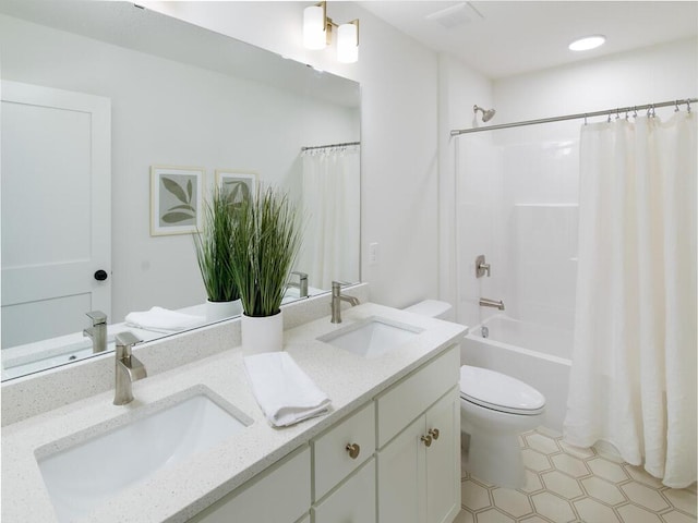 full bathroom featuring vanity, toilet, and shower / bathtub combination with curtain