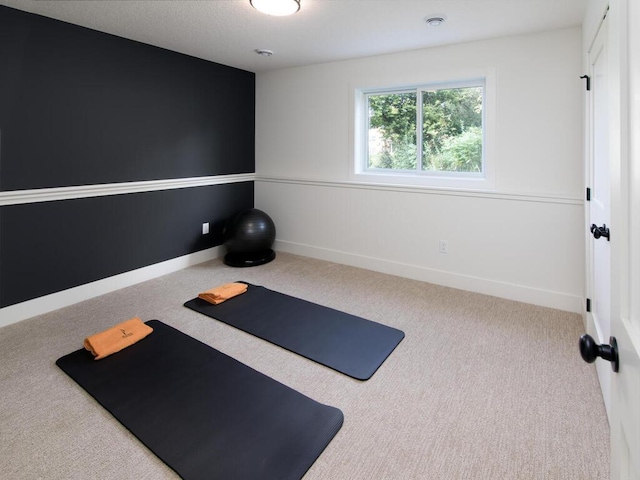 workout area featuring carpet