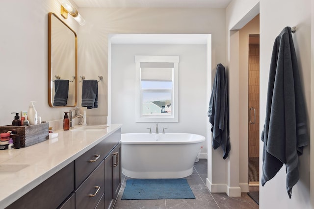 bathroom with vanity and a washtub