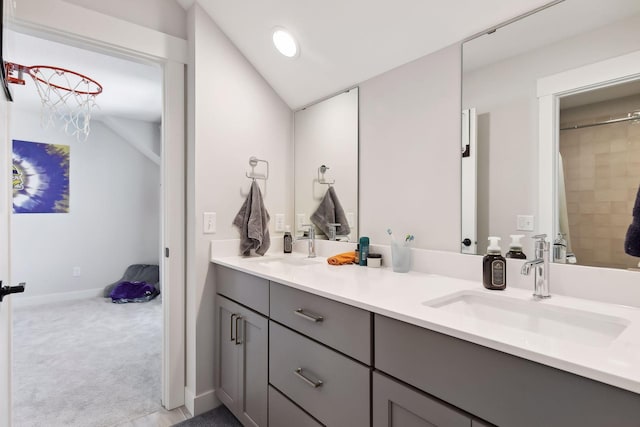 bathroom with vanity, vaulted ceiling, and a shower with shower curtain