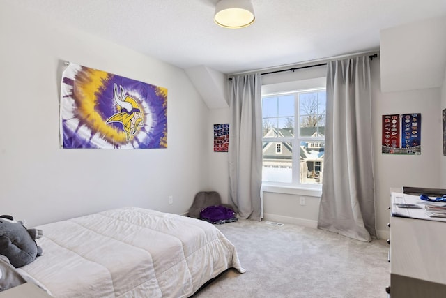 carpeted bedroom featuring a textured ceiling