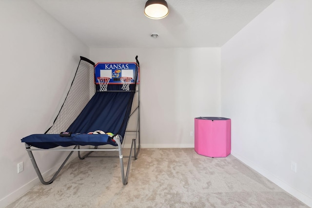 game room with light colored carpet