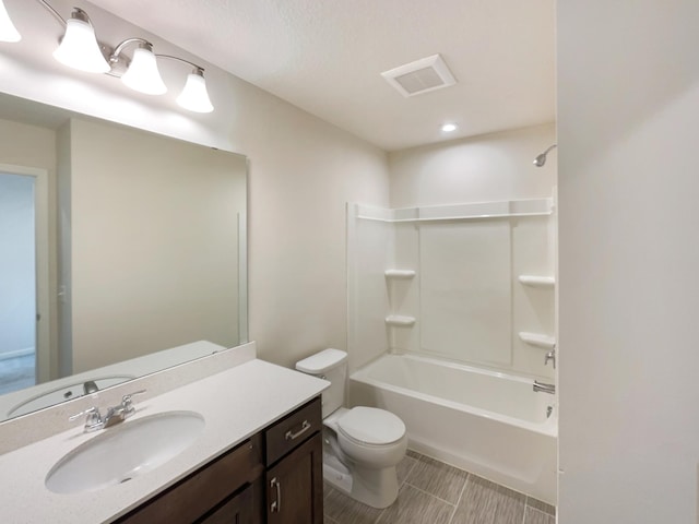 full bathroom featuring vanity, toilet, and shower / bathing tub combination