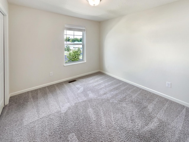 empty room featuring carpet flooring