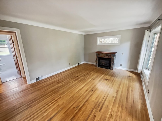 unfurnished living room featuring light hardwood / wood-style flooring