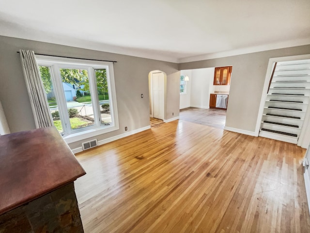 unfurnished living room with light hardwood / wood-style flooring