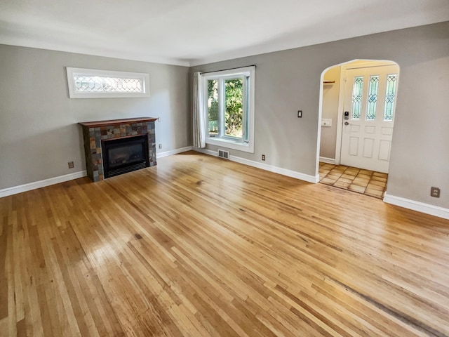 unfurnished living room with light hardwood / wood-style floors