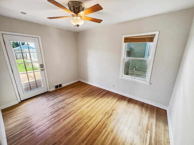 spare room featuring ceiling fan and hardwood / wood-style floors