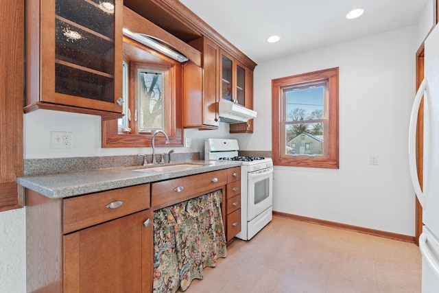 kitchen featuring sink and white appliances