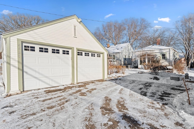 view of snow covered garage