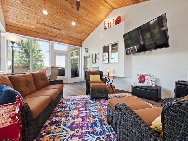 living room featuring high vaulted ceiling, wood finished floors, a wood stove, wooden ceiling, and recessed lighting