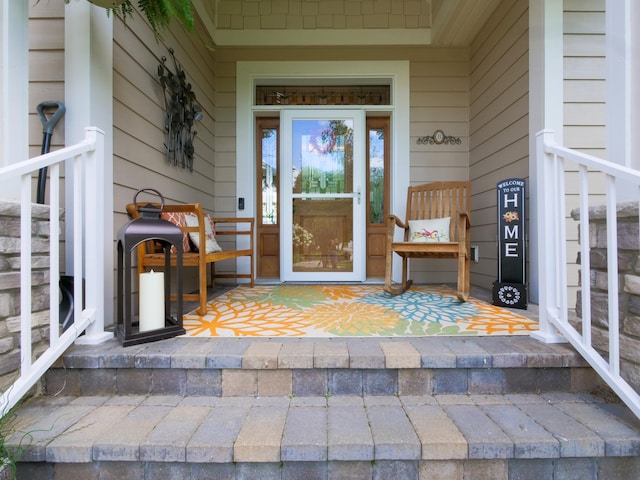 entrance to property featuring a porch
