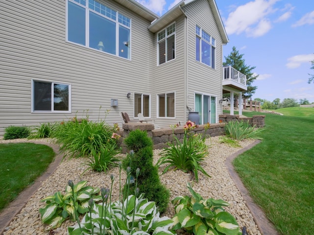 rear view of property with a yard