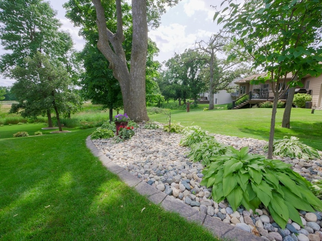 4424 Donway Dr NE, Alexandria, MN 56308 - view of green lawn featuring a deck and stairs