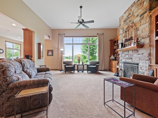 4424 Donway Dr NE, Alexandria, MN 56308 - living area with a ceiling fan, light colored carpet, a stone fireplace, and recessed lighting