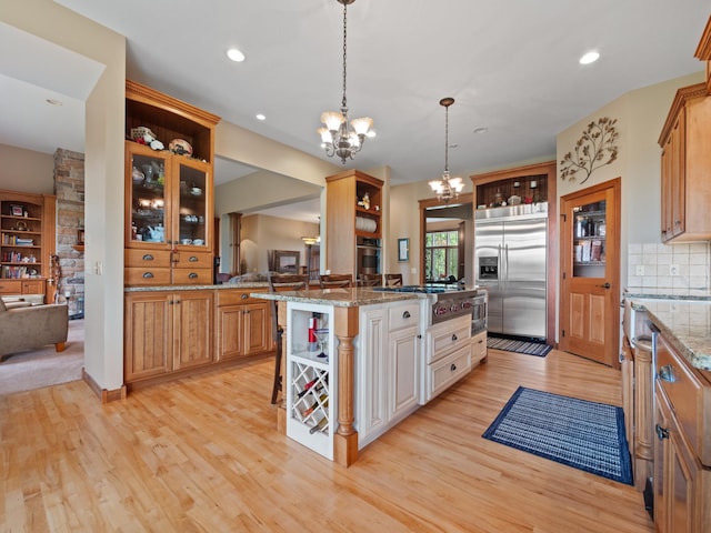 4424 Donway Dr NE, Alexandria, MN 56308 - kitchen with open shelves, stainless steel appliances, a chandelier, a kitchen bar, and recessed lighting