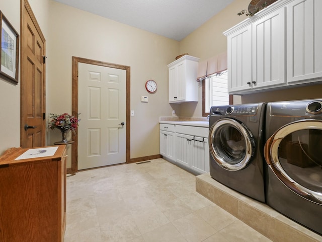 4424 Donway Dr NE, Alexandria, MN 56308 - laundry room featuring cabinet space and washer and clothes dryer