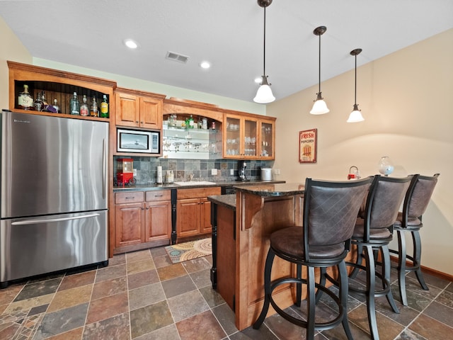 4424 Donway Dr NE, Alexandria, MN 56308 - indoor wet bar with appliances with stainless steel finishes, backsplash, stone tile flooring, pendant lighting, and recessed lighting