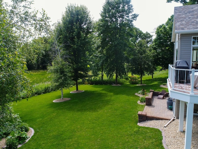 4424 Donway Dr NE, Alexandria, MN 56308 - view of grassy yard with a wooden deck and a patio