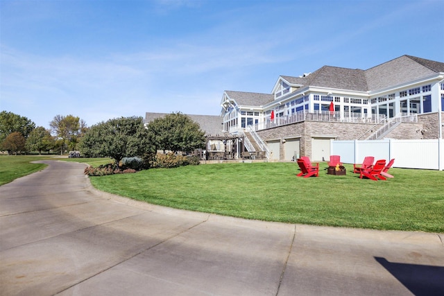 view of property exterior featuring a yard and a garage