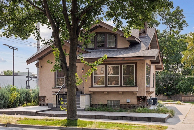 view of front of property featuring cooling unit