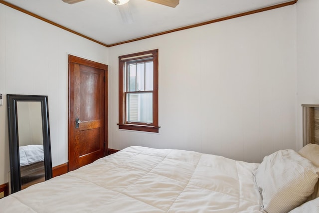 bedroom with ornamental molding and ceiling fan