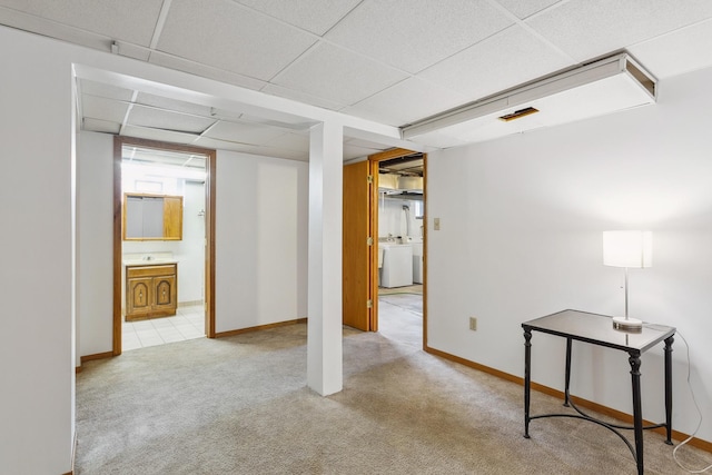 interior space featuring washer / dryer and a paneled ceiling