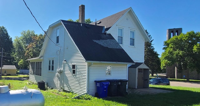 rear view of house with a lawn