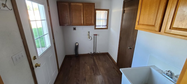 washroom featuring cabinets, sink, electric dryer hookup, hookup for a washing machine, and dark hardwood / wood-style flooring