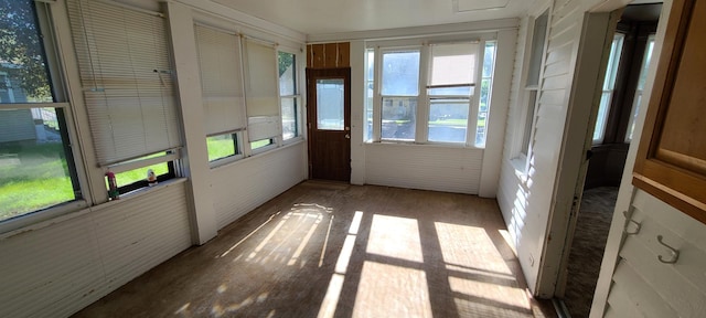 unfurnished sunroom with plenty of natural light