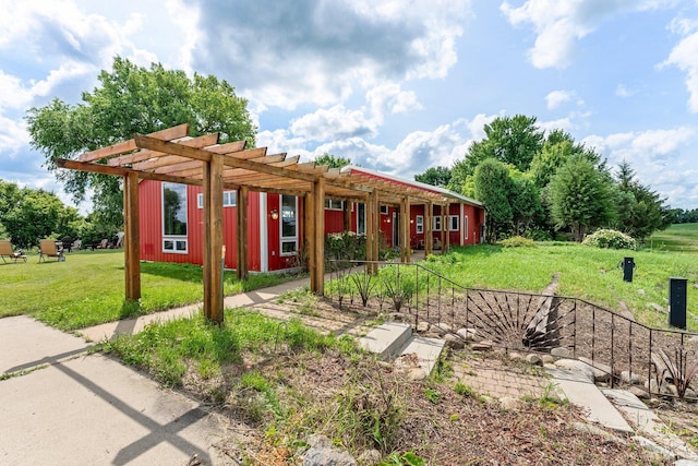 view of front facade featuring a pergola and a front lawn