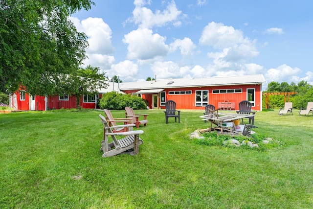 surrounding community with a yard and an outbuilding