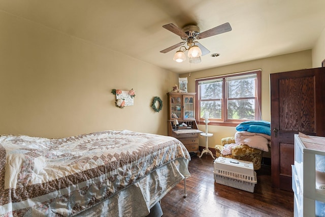 bedroom featuring ceiling fan and dark hardwood / wood-style flooring