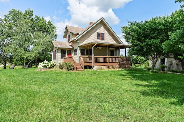 view of front of property featuring a front yard and a deck