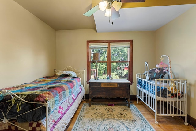 bedroom featuring wood-type flooring and ceiling fan