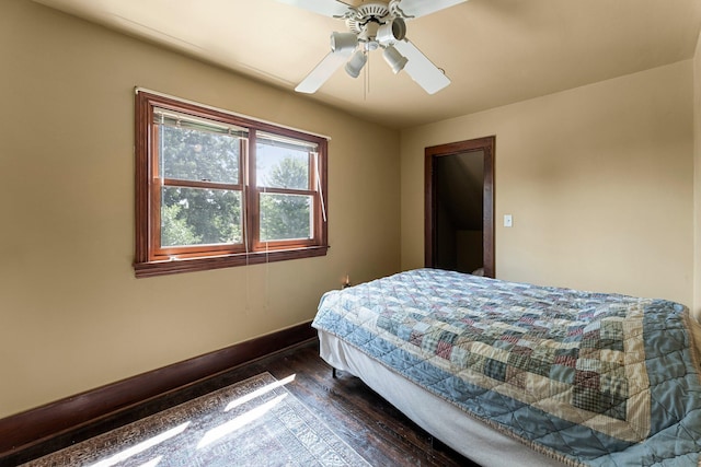 bedroom featuring dark wood-type flooring and ceiling fan