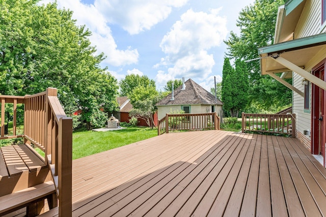 wooden terrace with a lawn