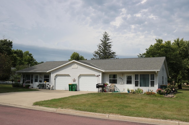 ranch-style home with a garage, a front lawn, and covered porch