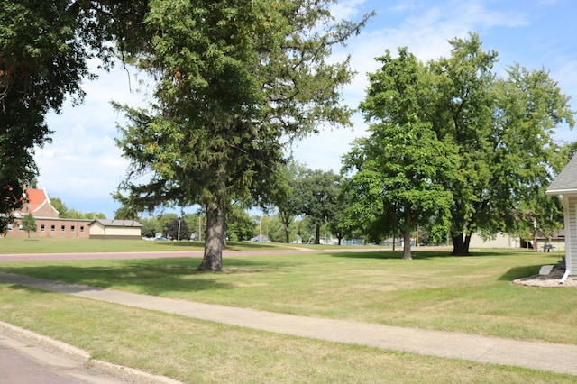 view of property's community with a lawn