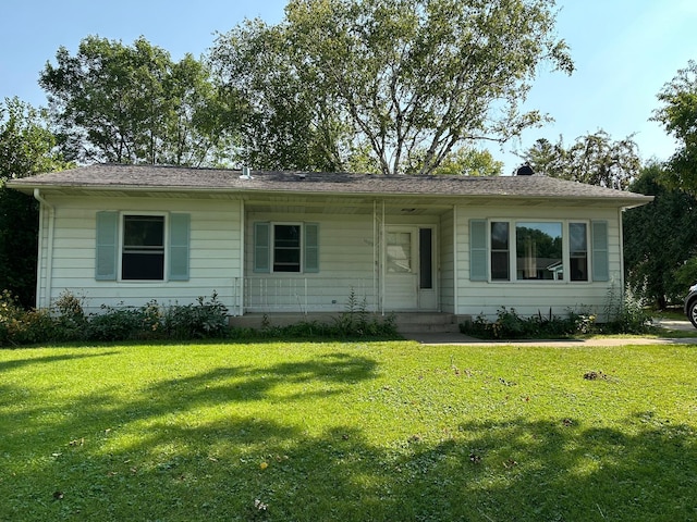 ranch-style home with a front yard