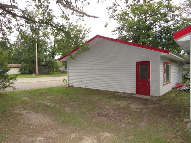 view of home's exterior with a lawn